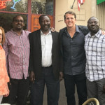 Director/Producer Kenneth A Carlson with Tom Pritchard, Executive Director of Sudan Sunrise, with Nubans enjoying the film.